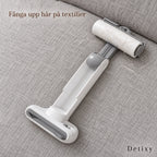 Detixy klädroller i handtaget på en grå soffa